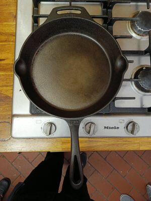 A clean cast iron pan sitting on the stove